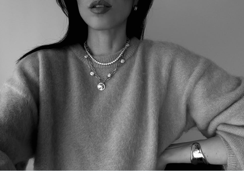 @evveroni wearing an Orelia neck stack featuring a tennis necklace